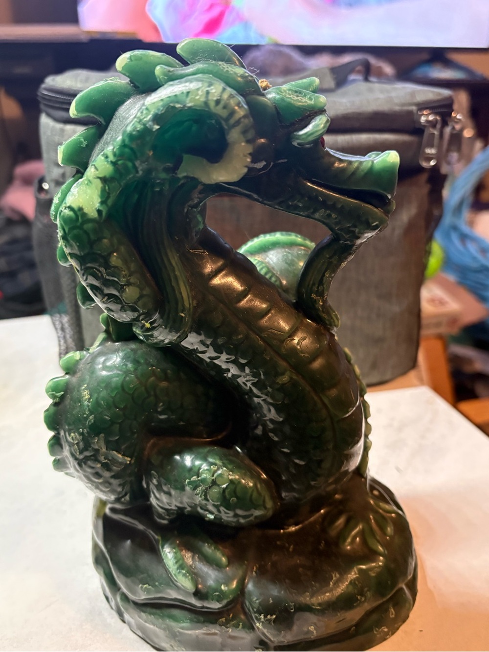 Vintage Chinese dragon sculpture made of green wax with red glass eyes